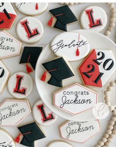 decorated cookies with graduation caps and numbers on them