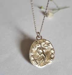 "Antique Coin pendant necklace, White gold coin necklace, 14k gold necklace, Roman coin necklace, 9k coin necklace, Solid gold necklace This 14k solid White gold necklace was 100% handmade and has an antique Roman coin for a pendant. This ancient coin necklace is unique and beautiful and will serve you long and well. Materials: The gold coin pendant and chain are made of 14k solid white gold. You can also buy the pendant only if you wish. Dimensions: The 14k gold necklace is available in multipl Yellow Gold Coin Pendant Necklace In Sterling Silver, 14k Gold Coin Pendant Charm Necklace, Yellow Gold Sterling Silver Coin Medallion Necklace, Tarnish Resistant Sterling Silver Coin Necklace In Yellow Gold, Gold Sterling Silver Coin Necklace With Round Pendant, White Gold Necklace With Round Disc Coin Pendant, White Gold Necklace With Coin Pendant, Silver Tarnish Resistant Coin Medallion Necklace, Silver Tarnish-resistant Coin Medallion Necklace