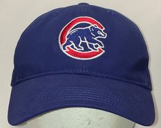 a chicago cubs baseball cap on a white mannequin's head with a red and blue bear embroidered on the front