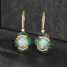 Ross-Simons - Opal Drop Earrings, .64ct t. w. Multicolored Diamonds, .70ct t. w. Multi-Gemstones. Our dreamy drop earrings call to mind the kind of lush greenery found in nature's most enchanting hideaways. Featuring 8x10mm oval opal cabochons that are encircled by artful borders of .64 ct. t. w. brown and white diamonds and .20 ct. t. w. tsavorite rounds with fanciful marquise emeralds that total .50 carats. Set in polished 14kt yellow gold. Hanging length is 1 3/8". Black rhodium at brown diam Diamond Multi-stone Earrings For Anniversary, Elegant Multi-stone Diamond Earrings, Formal Multi-stone Diamond Earrings, White Diamond Multi-stone Earrings, Elegant Oval Multi-stone Earrings, Oval Multi-stone Earrings For Wedding, Oval Multi-stone Wedding Earrings, Multi-stone Drop Earrings For Anniversary, Elegant Gold Gemstones Gia Certified