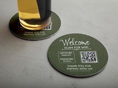 two coasters with the words, welcome and scan for wifi on them