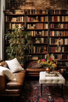 a living room filled with lots of furniture and bookshelves covered in shelves full of books