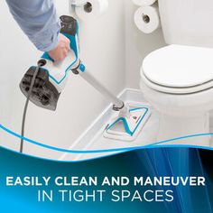 a person using a steam mop to clean a toilet in a bathroom with the words easily clean and maneuver in tight spaces