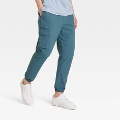 Why we're ALL IN: Solid-hued cargo jogger pants made from quick-dry fabric with moisture-wicking properties to help keep you cool and dry during a range of activities. Designed in a tapered-leg silhouette with elastic at the leg openings for a snug, stay-put fit. Side zipper pockets and side cargo pockets complete the look with functional flair. All in Motion™: Made for every move, priced for every day. Casual Joggers With Functional Pockets For Jogging, Casual Jogging Pants With Functional Pockets, Casual Jogging Bottoms With Functional Pockets, Casual Cargo Pants With Side Pockets For Jogging, Casual Moisture-wicking Joggers For Outdoor, Casual 4-way Stretch Joggers For Outdoor, Functional Midweight Joggers With Pockets, Nylon Joggers With 4-way Stretch And Pockets, Sporty 4-way Stretch Cargo Pants For Outdoor