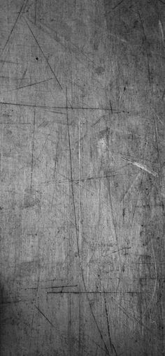 a black and white photo of a wall with lines drawn on it, as well as a clock