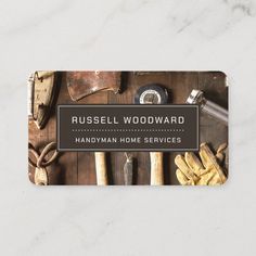 business card for russell woodward handyman home services, with tools on the table