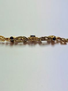 Stunning Vintage 14K White and Yellow Gold Diamond Sapphire Bracelet: Stunning Genuine Diamonds and Natural Sapphires Sapphire(s): 1.25CT Diamond(s): 0.80CT Color: F Clarity: SI1 Total Bracelet Weight: 17.5GR Bracelet Length: 7in Bracelet Width: 1cm 14K White and Yellow Gold For more information regarding this item feel free to reach me so I can accommodate your needs. Thank you Formal 14k Gold Hand Set Jewelry, Formal Hand-set 14k Gold Jewelry, Formal Hand Set 14k Gold Jewelry, Formal Fine Jewelry Bracelet With Elegant Design, Elegant Fine Jewelry Bracelet For Formal Occasions, Formal Fine Jewelry Bracelet, Formal 14k Gold Chain Bracelet With Gemstones, Luxury Oval Gold Bracelet For Formal Occasions, Luxury Gold Bracelet With Gemstones For Formal Occasions