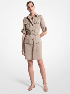 A modern juxtaposition of utility and luxury, this shirtdress is crafted from organic cotton poplin for a crisp feel. Flap pockets and a removable grommeted belt define the surplus-inspired design, while polished snap fastenings conceal a full-zip closure. Echo the season’s styling by wearing yours with flat sandals. Cotton Shirt Dress With Belted Cuffs For Work, Cotton Dress With Roll-up Sleeves For Work, Cotton Shirt Dress With Pockets For Work, Belted Cotton Shirt Dress For Work, Spring Workwear Dress With Flap Pockets, Spring Workwear Dresses With Patch Pockets, Spring Utility Workwear Dress, Spring Utility Dress For Workwear, Business Suit