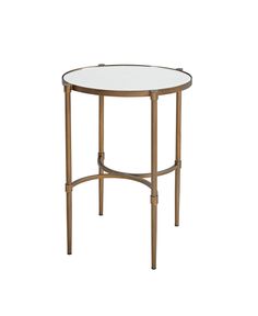 a round glass table with metal legs and a gold frame around the top, against a white background