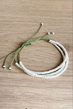 Waterproof and adjustable waxed cord bracelet with seed beads. Olive green and matte cream. Diy Cord Bracelets With Beads, Waxed Thread Bracelets, Cheap White Braided Bracelet With Colorful Beads, Wax Thread Bracelets, Cord Bracelet Diy, Anklets Diy, Jewelry Wax, Wax Cord Bracelet, Homemade Bracelets