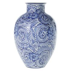 a blue and white vase sitting on top of a table