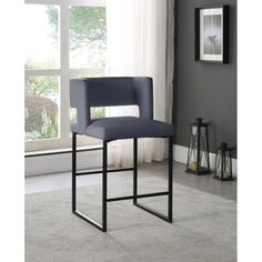 a black bar stool in front of a window