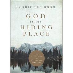 the book cover for god is my hiding place by corrie ten boom, with mountains in the background