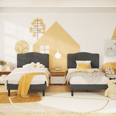 a bedroom with two beds and a teddy bear on the rug in front of it