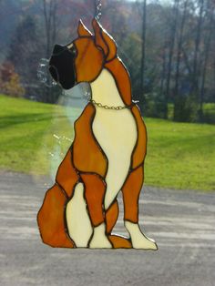 a stained glass dog sitting on the ground