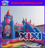 an inflatable bounce castle with slide and slides