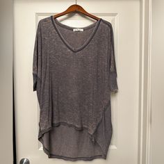 Free People We The Free Hi-Lo Oversized T Nwot Xs But Runs Large Slouchy Short Sleeve Tops For Loungewear, Casual Slouchy V-neck Tops, Oversized Gray Batwing Sleeve Top, Relaxed Gray Top For Spring, Relaxed Gray Tops For Spring, Casual Slouchy Batwing Sleeve Tops, Oversized Gray V-neck Top, Free People Tops, Free People