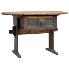 an old wooden table with two drawers