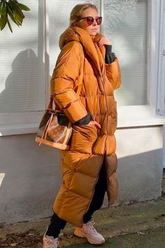 woman wearing a full-length puffer coat in rust orange Winter Days, Get Creative, Winter Day, Cold Winter, Classic Black, You Think, Knee Length, Puffer