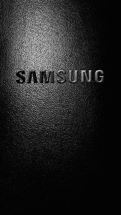 the samsung logo is shown in black and white, as well as silver lettering on a dark background