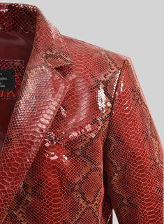 Be labeled as a trendsetter with our Bold Red Python Western Leather Blazer that has a touch of elegance and style, making you the most affable personality in the room. So create the most amazing attire with our leather blazer that will be strong couture in your closet.    Made Using Pure Napa Sheep Skin Leather.  Look Includes   Bold Red Python Leather Color  Two Button Jacket Style  Single Vent  Western Leather Blazer Style    Click 'Customize Now' to modify the look if needed.   Made as per Luxury Leather Jacket With Crocodile Pattern For Fall, Luxury Crocodile Pattern Leather Jacket, Luxury Red Blazer For Work, Luxury Red Blazer For Workwear, Designer Red Blazer For Business, Luxury Red Blazer With Notch Lapel, Chic Red Blazer For Formal Occasions, Luxury Red Blazer For Parties, Formal Red Leather Jacket