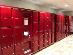 a row of red lockers sitting next to each other