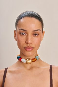 An assorted bead choker necklace with a gold-toned adjustable chain. — Assorted beads — Choker length — Lobster clasp — Gold-toned chain Bold Adjustable Gold Jewelry, Trendy Gold Jewelry With Large Beads, Adjustable Large Bead Choker Jewelry, Adjustable Large Beads Choker Jewelry, Adjustable Large Beaded Choker Jewelry, Large Beads Choker Necklace, Face References, Bead Choker Necklace, Beads Choker