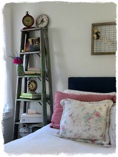 a room with a bed, bookshelf and clock on the wall above it