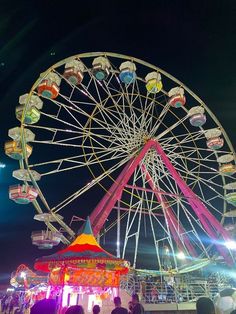 a ferris wheel at an amusement park during the night