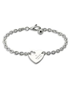 Gucci Sterling Silver Trademark Heart Charm Bracelet Gucci White Gold Jewelry For Anniversary, Luxury Sterling Silver Heart Bracelet For Gift, Luxury Silver Bracelets For Valentine's Day, Designer Jewelry Bracelet With Logo Charm, Designer Logo Charm Bracelet Jewelry, Gucci Sterling Silver Bracelet, Luxury Sterling Silver Bracelets For Valentine's Day, Luxury Sterling Silver Heart Bracelet For Anniversary, Luxury Heart Bracelet As A Gift