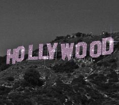 the hollywood sign is lit up in pink