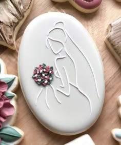 a decorated cookie sitting on top of a wooden table