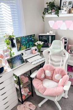 a white desk topped with a pink chair next to a computer