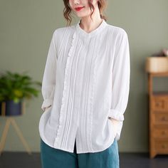 French White Stand Collar Button Ruffled Blouses Long SleeveFabric: Cotton BlendedSize & Fit: Fit: This garment fits true to size.Length: Size L measures 24.57"from shoulder to hemBust: Great for any cup size. Waist: Loose Fit. Comfortable room throughout midsection.Hip: Loose Fit - room for hips. Hand Wash Cold. Long Sleeve Off-white Cotton Blouse, White Cotton T-shirt With 3/4 Sleeves, White Relaxed Fit Top With 3/4 Sleeves, Off-white Casual Ruffled Tops, White 3/4 Sleeve Top With Button Closure, Ruffle Long Sleeve Blouse, Long Blouse, Stand Collar, Tunic Tops