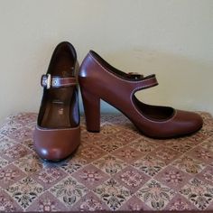 Rockport Nwt Tags, Never Worn Rockport Mary Janes. Chocolate Brown With Black Trim And Gold Grommets And Buckle. 4" Heal. Size 8.5. Super Comfy. Perfect. Classic. Small Scuff Mark On Heal From People Trying On. See Photos. Never Worn. Fitted Brown Heels With Almond Toe, Brown Almond Toe Heels, Brown Heels With Buckle Closure For Fall, Fitted Brown Heels With Ankle Strap, Casual Brown Heels For Work, Brown Fitted Leather Heels, Casual Brown Heels Medium Width, Classic Brown Heels For Spring, Casual Brown Faux Leather Heels