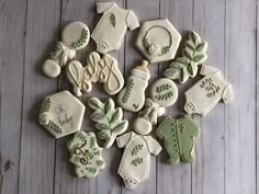 decorated cookies arranged in the shape of christmas stockings and stocking on a wooden table