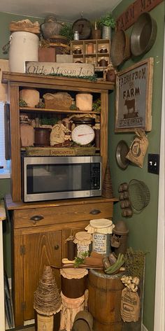 a microwave sitting on top of a wooden cabinet