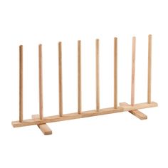 a wooden rack with four sticks sticking out of it's sides on a white background