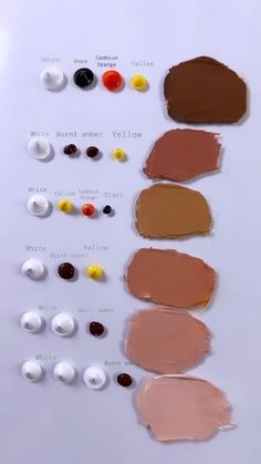 the different shades of lipstick are arranged on a white surface, including brown, red, and yellow