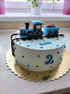 a birthday cake with a train on top