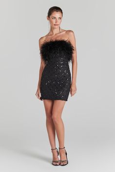 Harlow Black Dress Women's Clothing > Dresses. DESCRIPTION &   FEATURES   Meet HARLOW BLACK. An elegant sequin bodycon mini that makes an entrance. Designed with a full feather bodice and made with embellished beadwork and sequins that will shimmer through the day. Featuring our classic boning for comfortable cinching, prepare to turn heads in this figure-hugging show-stopper.   - Designed from our exclusive black embellished fabric with pearl beadwork detail   - Internal corset boning   - Fully Black Embellished Dress, Nadine Merabi, Embellished Fabric, Fitted Bodycon Dress, Corset Boning, Feather Trim, Bodycon Fashion, Womens Black Dress, Embellished Dress