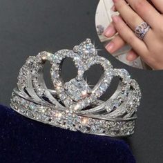 a close up of a person's hand holding a tiara