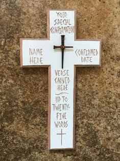 a wooden cross with words written on it