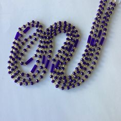 This women's waist bead is a unique and handcrafted accessory that is ready to ship. The beads are made with  gold and blue crystals glass beads, which provide a beautiful and eye-catching appearance. The colors of the beads are the same, but the design may vary, making each strand of waist beads unique and one-of-a-kind. The tie-on waist beads are easy to wear and adjust, ensuring a comfortable fit for the wearer. Each purchase is for one strand of waist beads, which is approximately 60 inches Blue Beaded Necklace For Party, Gold Beaded Crystal Necklaces, Gold Crystal Necklaces With Round Beads For Party, Blue Beaded Necklaces With Tiny Beads For Party, Blue Beaded Necklace With Tiny Beads For Party, Party Crystal Necklaces With Polished Round Beads, Blue Party Beaded Necklace With Tiny Beads, Elegant Party Waist Beads With Faceted Beads, Elegant Round Beads Waist Beads For Party