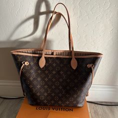 Gently Used Louis Vuitton Neverfull Mm In Monogram With Beige Interior. Excellent Condition- 2 Small Ink Marks In Bottom Liner. Pochette Not Included. This Bag Has Been My Pride And Joy. Always Kept In Dust Bag (Included). Original Box And Receipt Also Included. Bottom Liner, Used Louis Vuitton, Beige Interior, Louis Vuitton Neverfull Mm, Neverfull Mm, Vuitton Neverfull, Louis Vuitton Neverfull, Louis Vuitton Bag, Original Box