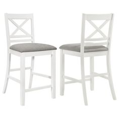 two white stools with grey cushions against a white background, one has a cross back and the other has a square seat