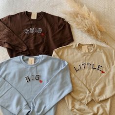 three sweaters with the words big and little on them