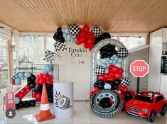 a car themed birthday party with balloons and decorations