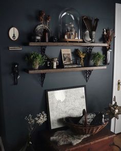 a room with some shelves on the wall and other things on the shelf in front of it