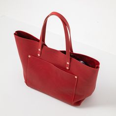 The Red Cypress Market Tote is a large bag made of beautiful full-grain leather. Red Cypress is a thick and soft leather, with a beautiful pebbled grain and a vibrant red color. The Red Cypress Market Tote comes standard with Red handles. Tote Beach Bag, Large Leather Tote Bag, Leather Tote Bags, Carryall Tote, Large Leather Tote, Work Tote, Weekend Bag, Market Tote, Tote Bag Leather